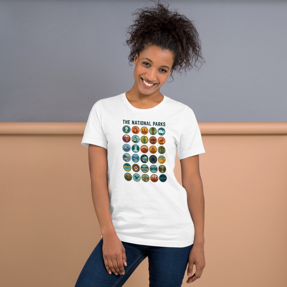 Woman wearing the white national parks badge grid t-shirt outdoors in a relaxed everyday fit