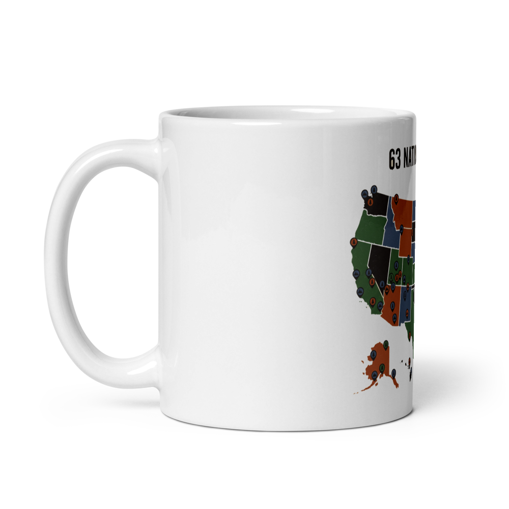 National park map mug shown with the handle on the left so the artwork faces out for left-handed users