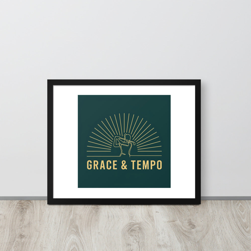 The Swing Grace and Tempo black framed poster on a neutral wall, emerald and antique gold golf art for women golfers