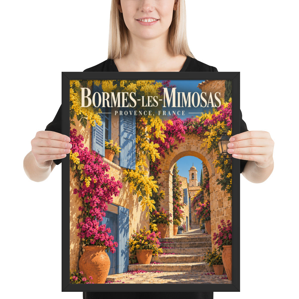 16″×20″ black-framed Bormes-les-Mimosas print, shown with a person for scale