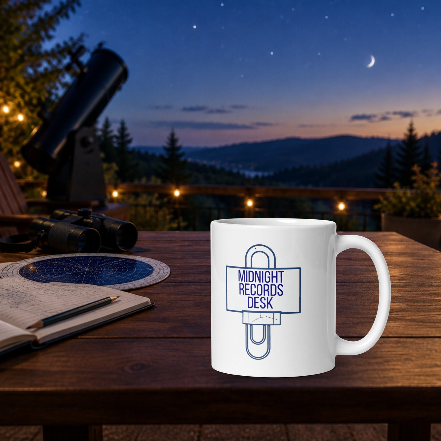 Midnight Records Desk astronomy log mug on a deck table at dusk beside an open observing logbook, planisphere, binoculars and a telescope