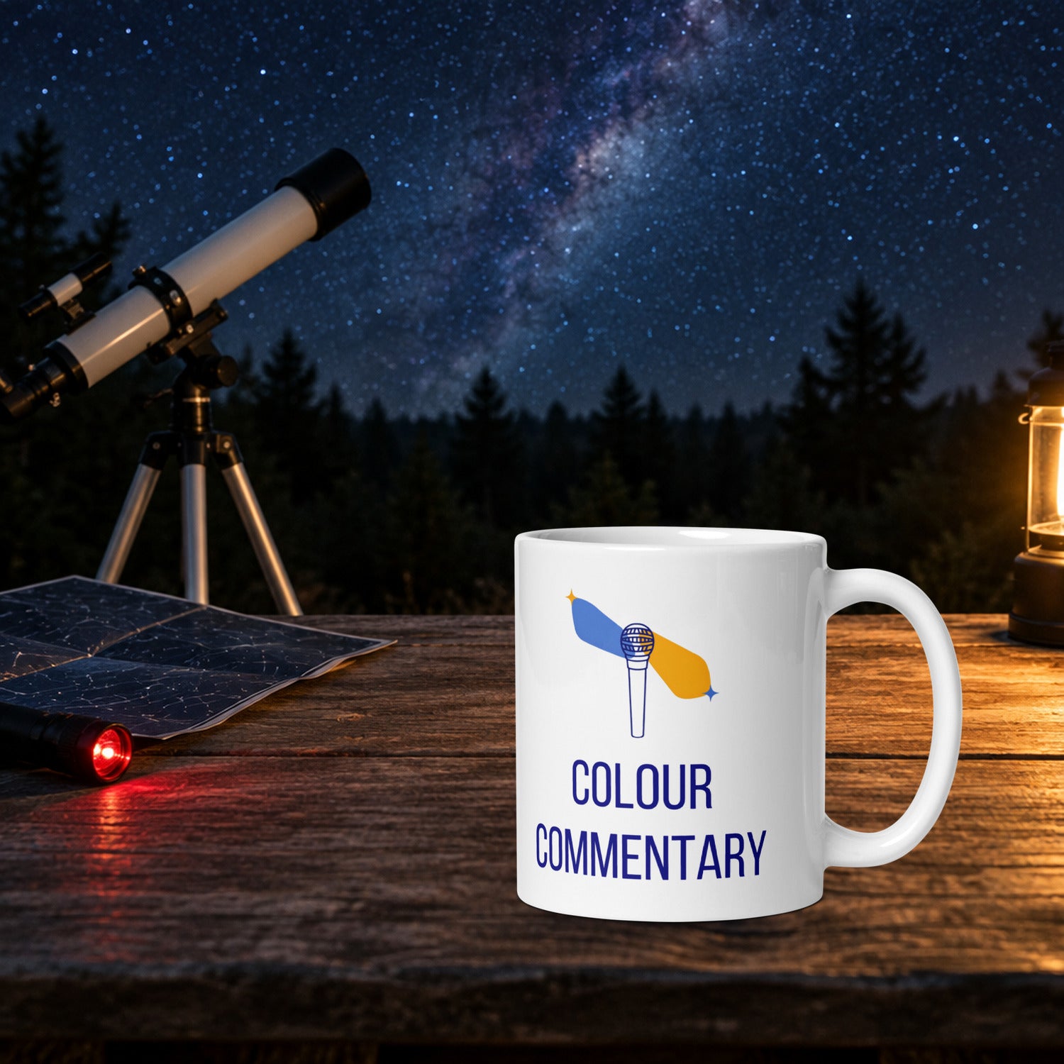 Colour Commentary double star mug on a wooden table on observing night, with a telescope, star chart and red flashlight under a starry Milky Way sky