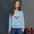 Glacier National Park badge crewneck sweatshirt in light blue, outdoor lifestyle shot