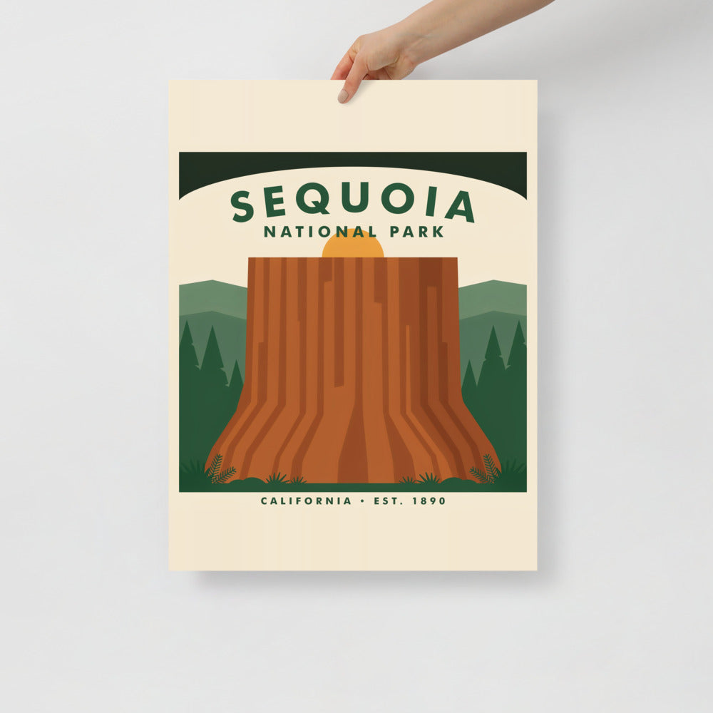 Hand holding the Sequoia National Park vintage poster against a plain wall
