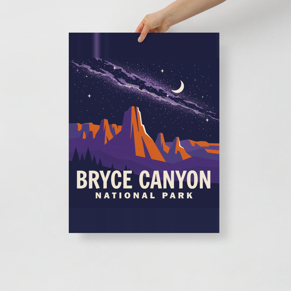 Hand holding the Bryce Canyon National Park vintage poster against a plain wall