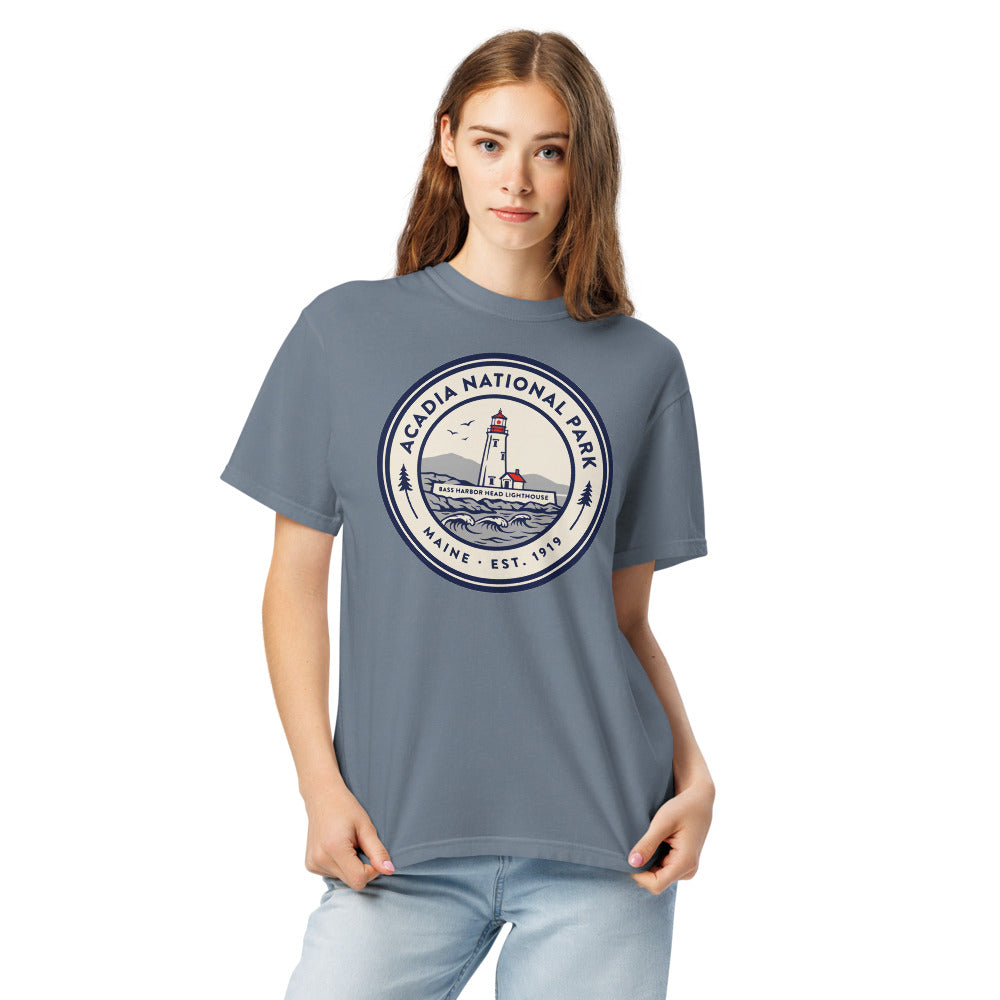 Acadia National Park vintage lighthouse badge t-shirt in blue jean worn by a model, front view, second angle