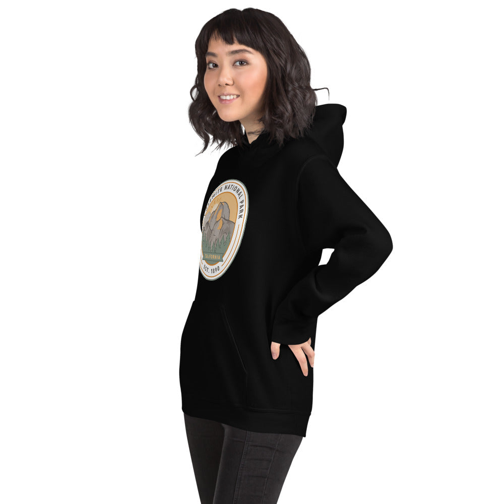Yosemite National Park vintage Half Dome sunrise badge hoodie in black worn by a woman, side angle