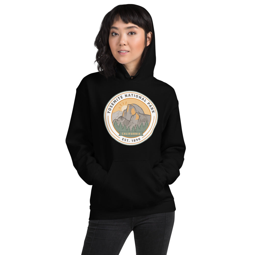Yosemite National Park vintage Half Dome sunrise badge hoodie in black worn by a woman, front view