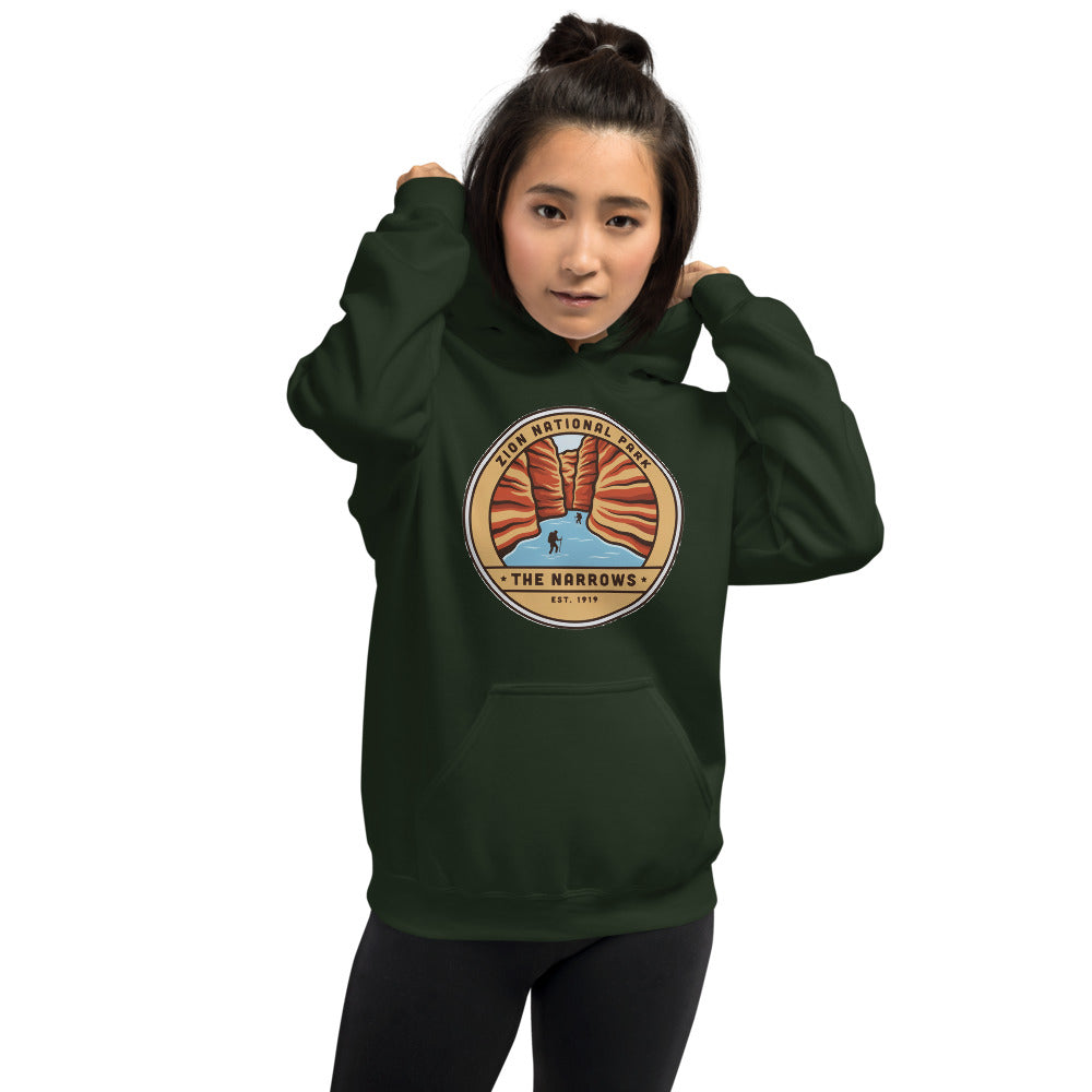 Zion National Park vintage The Narrows canyon badge hoodie in forest green worn by a woman, front view