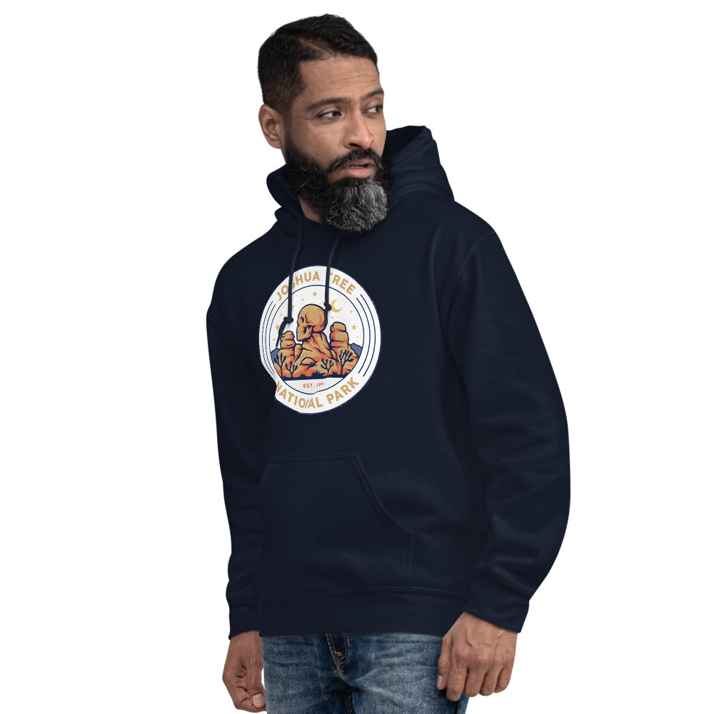 Joshua Tree National Park vintage desert boulders and stars badge hoodie in navy worn by a man, side angle