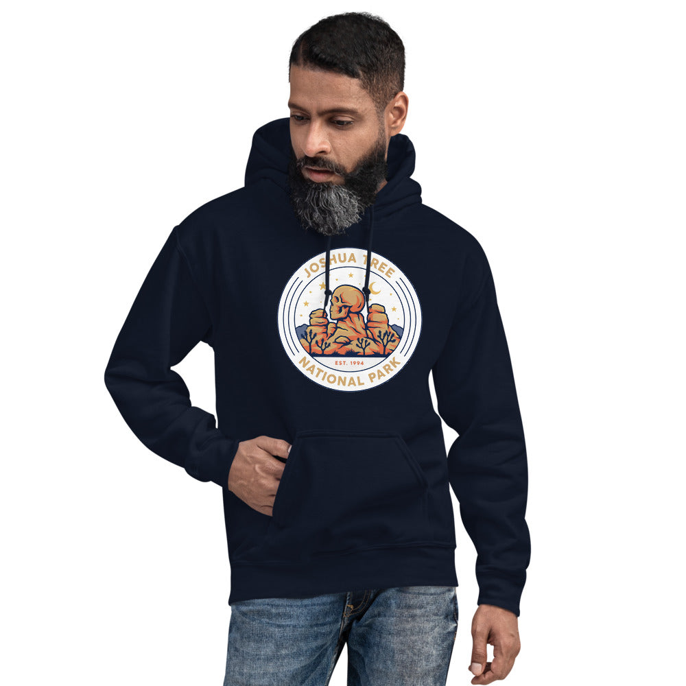 Joshua Tree National Park vintage desert boulders and stars badge hoodie in navy worn by a man, front view