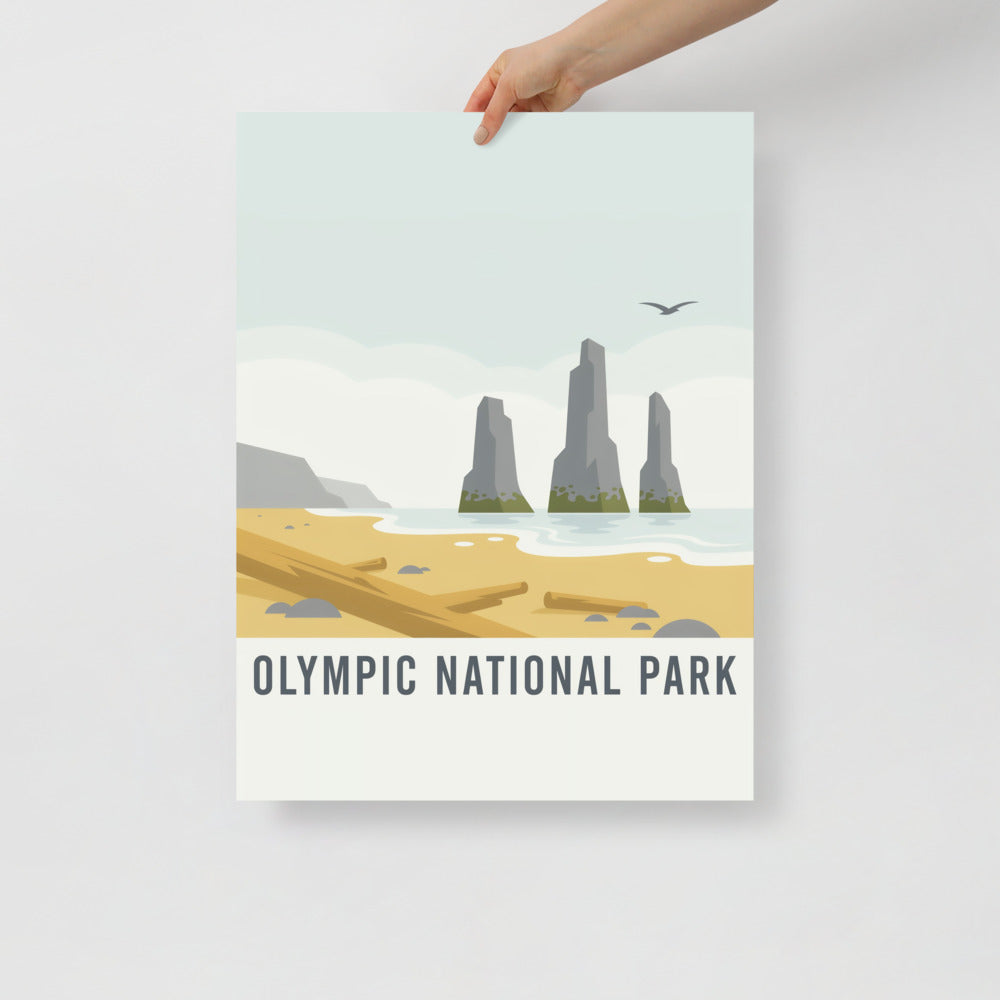 Hand holding the Olympic National Park vintage poster against a plain wall
