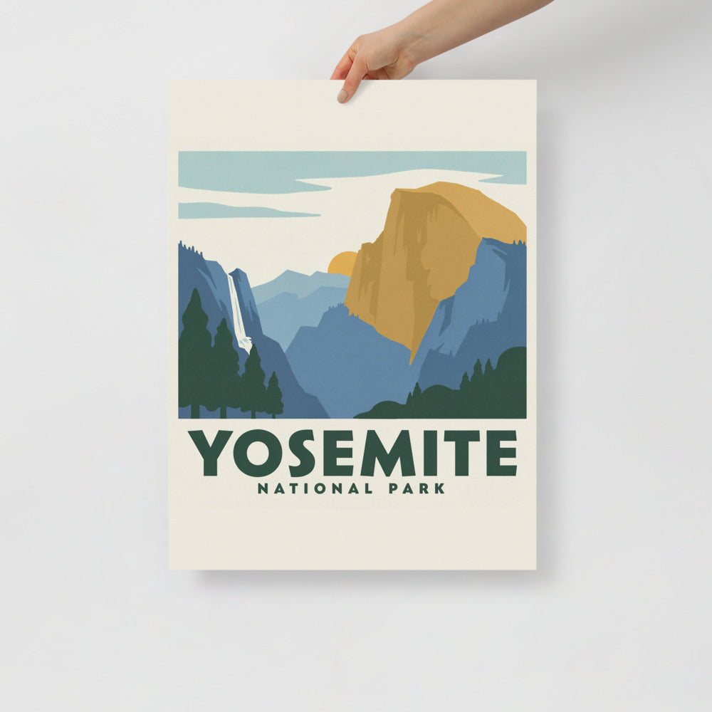 Yosemite National Park vintage travel poster held at one corner against a plain wall