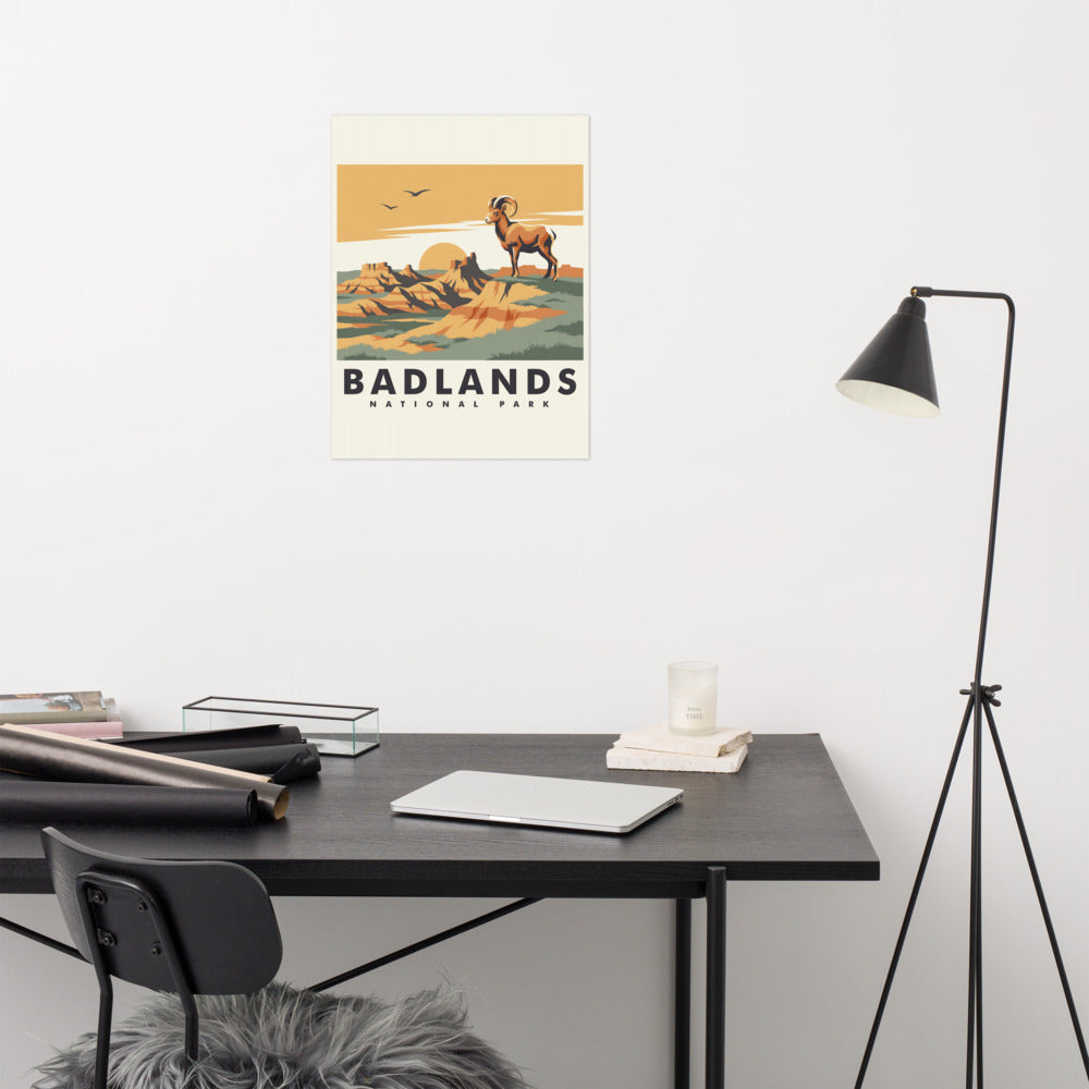 Badlands National Park vintage travel poster with a bighorn ram above eroded rock spires, hanging above a desk in a home office