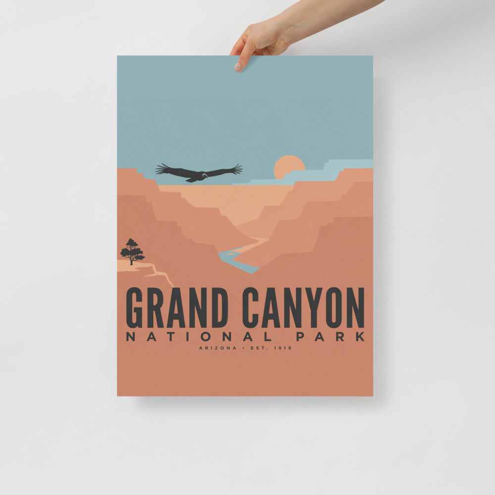 Grand Canyon National Park vintage travel poster held at one corner against a plain wall