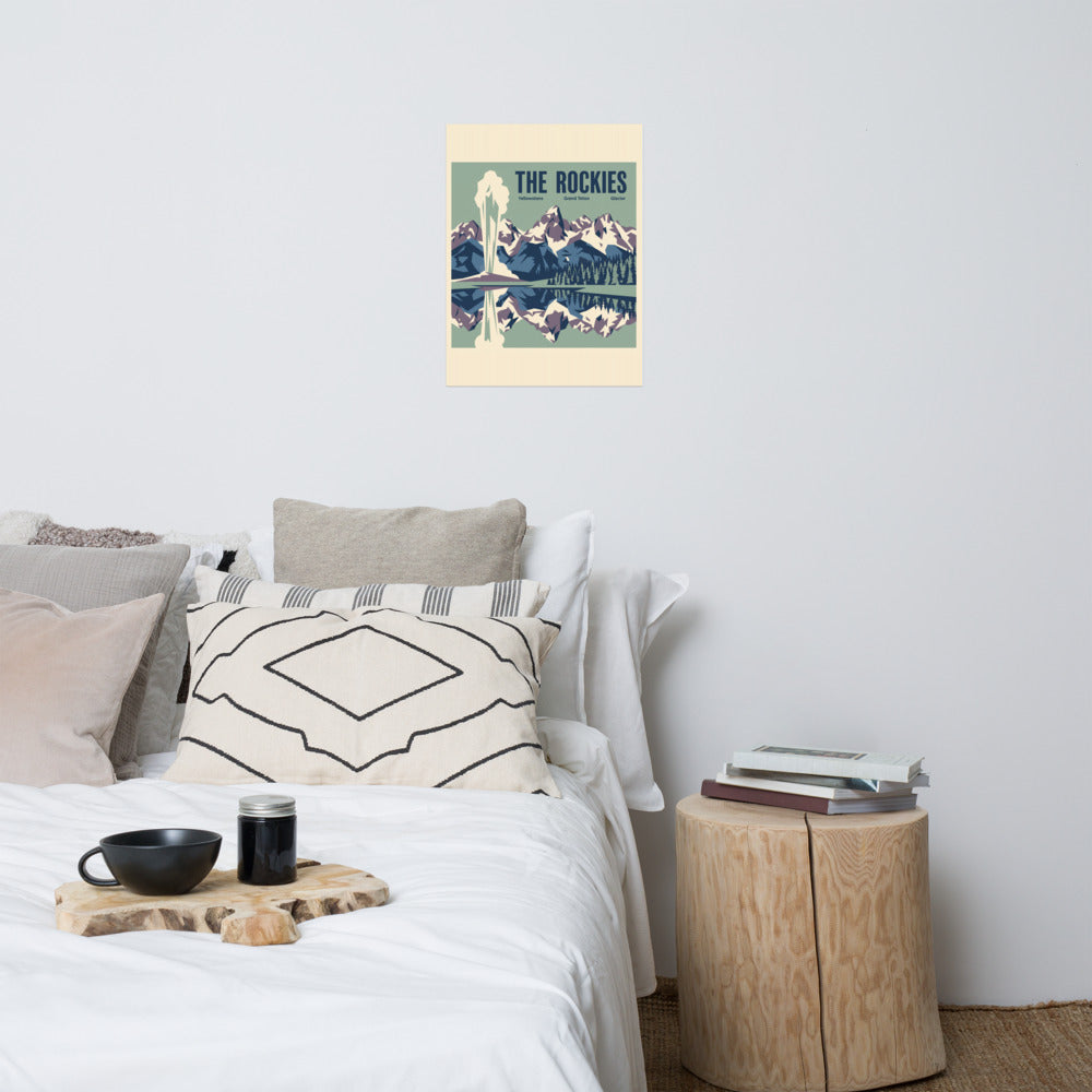 The Rockies vintage travel poster showing Yellowstone, Grand Teton and Glacier as one mountain panorama, hanging above a bed in a styled bedroom