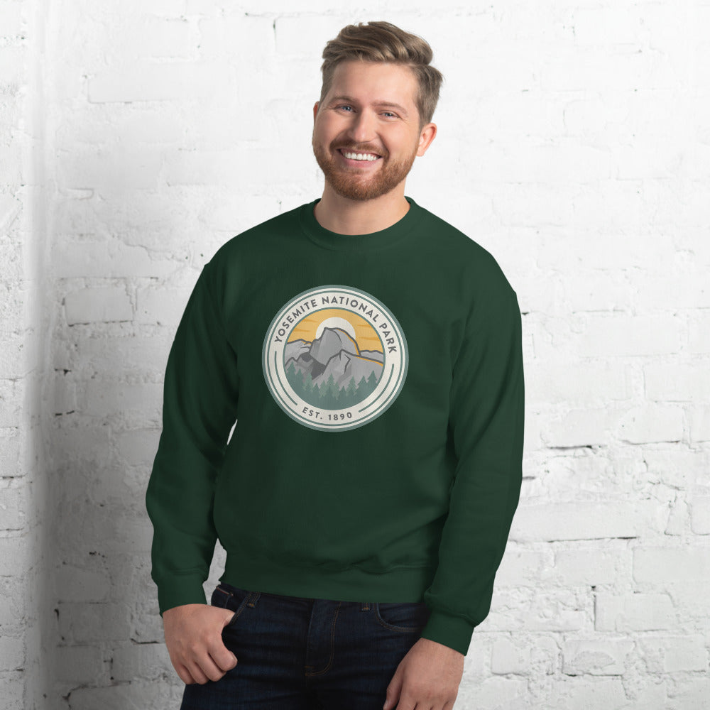 Yosemite National Park badge crewneck sweatshirt in forest green, outdoor lifestyle shot