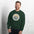 Yosemite National Park badge crewneck sweatshirt in forest green, outdoor lifestyle shot