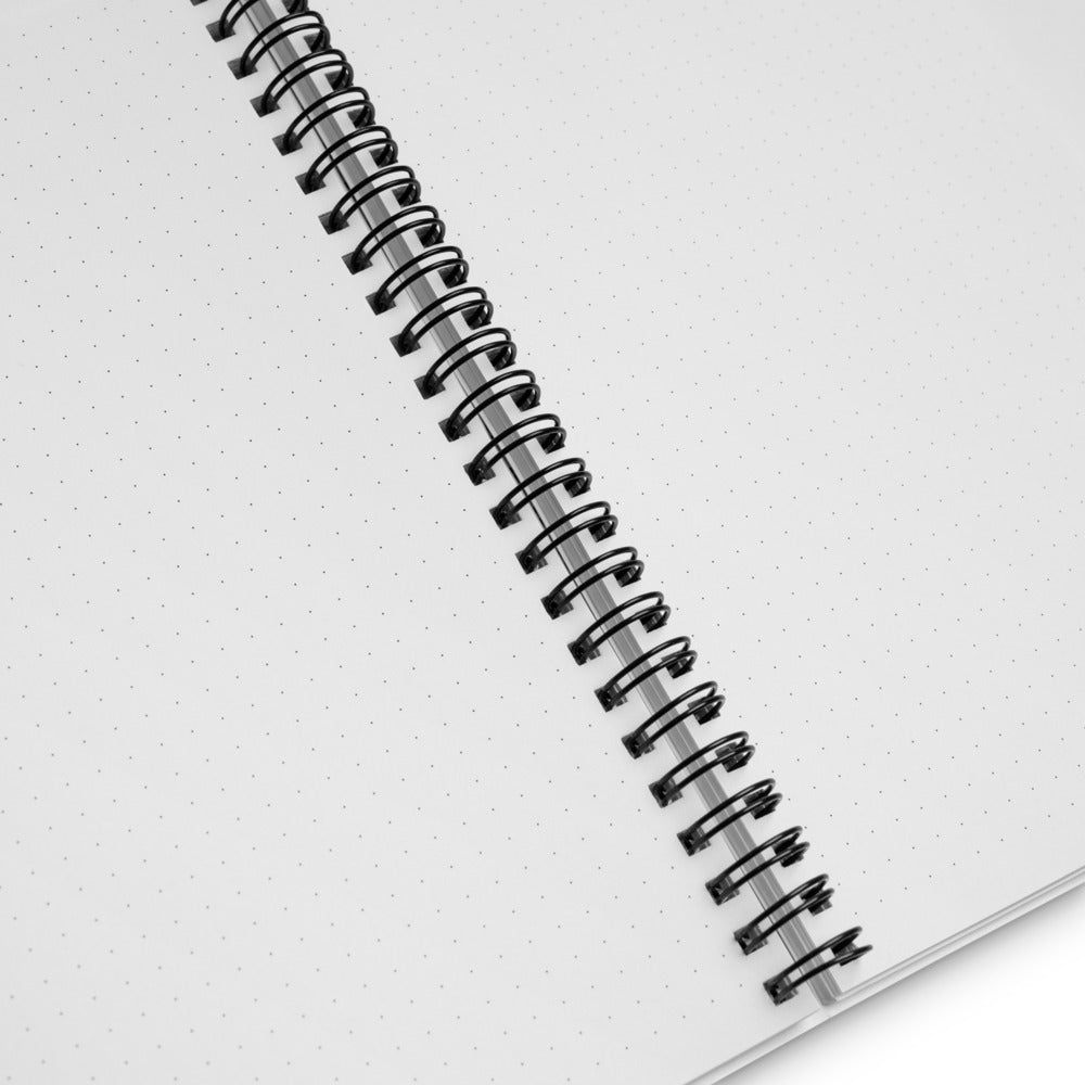 Inside the Keeping Tabs astronomy notebook: dotted pages that lie open on a black metal spiral, ready for sky sketches and observing notes