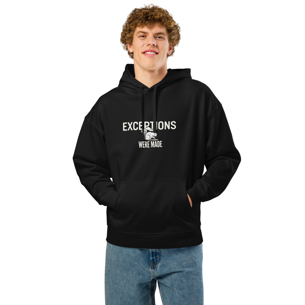 Man wearing the black squirrel hoodie with EXCEPTIONS WERE MADE around a squirrel eating seed