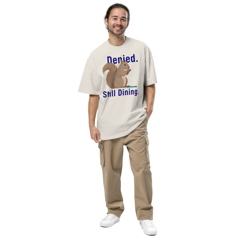 Man wearing the faded bone squirrel shirt with Denied. Still Dining. around a squirrel eating a seed