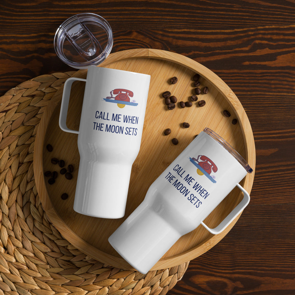 Two Call Me When the Moon Sets 25 oz travel mugs on a wooden tray with coffee beans, seen from above