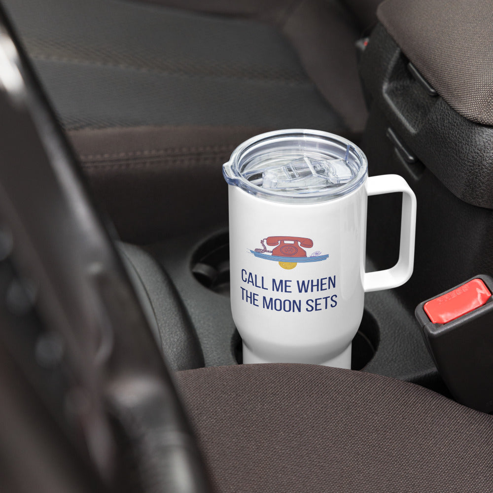 Call Me When the Moon Sets 25 oz travel mug sitting in a car cup holder, ready for a drive to a dark-sky site