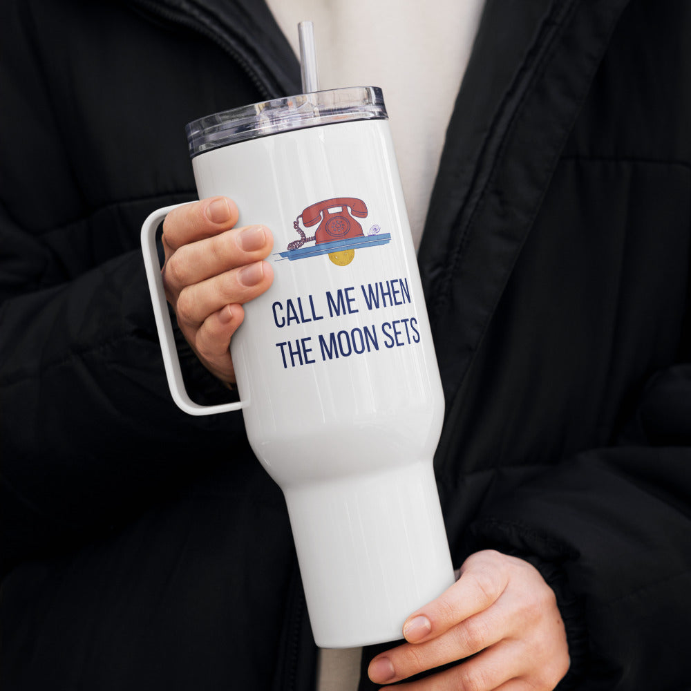 Person in a winter coat holding the Call Me When the Moon Sets 40 oz travel mug with straw