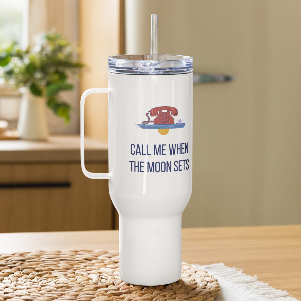Call Me When the Moon Sets 40 oz astronomy travel mug with straw lid on a woven mat in a sunny kitchen