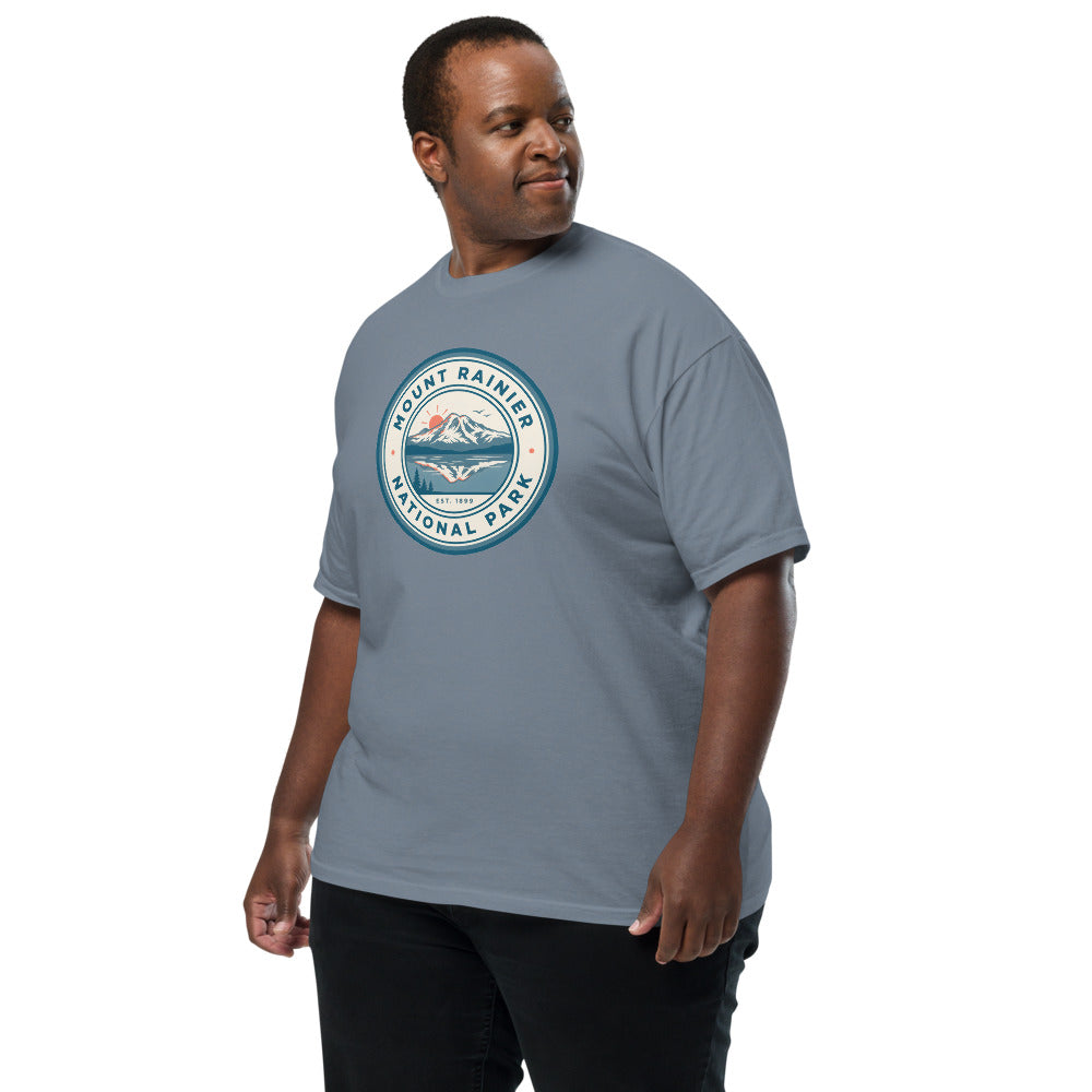 Mount Rainier National Park badge tee worn by a model in Blue Jean, side angle