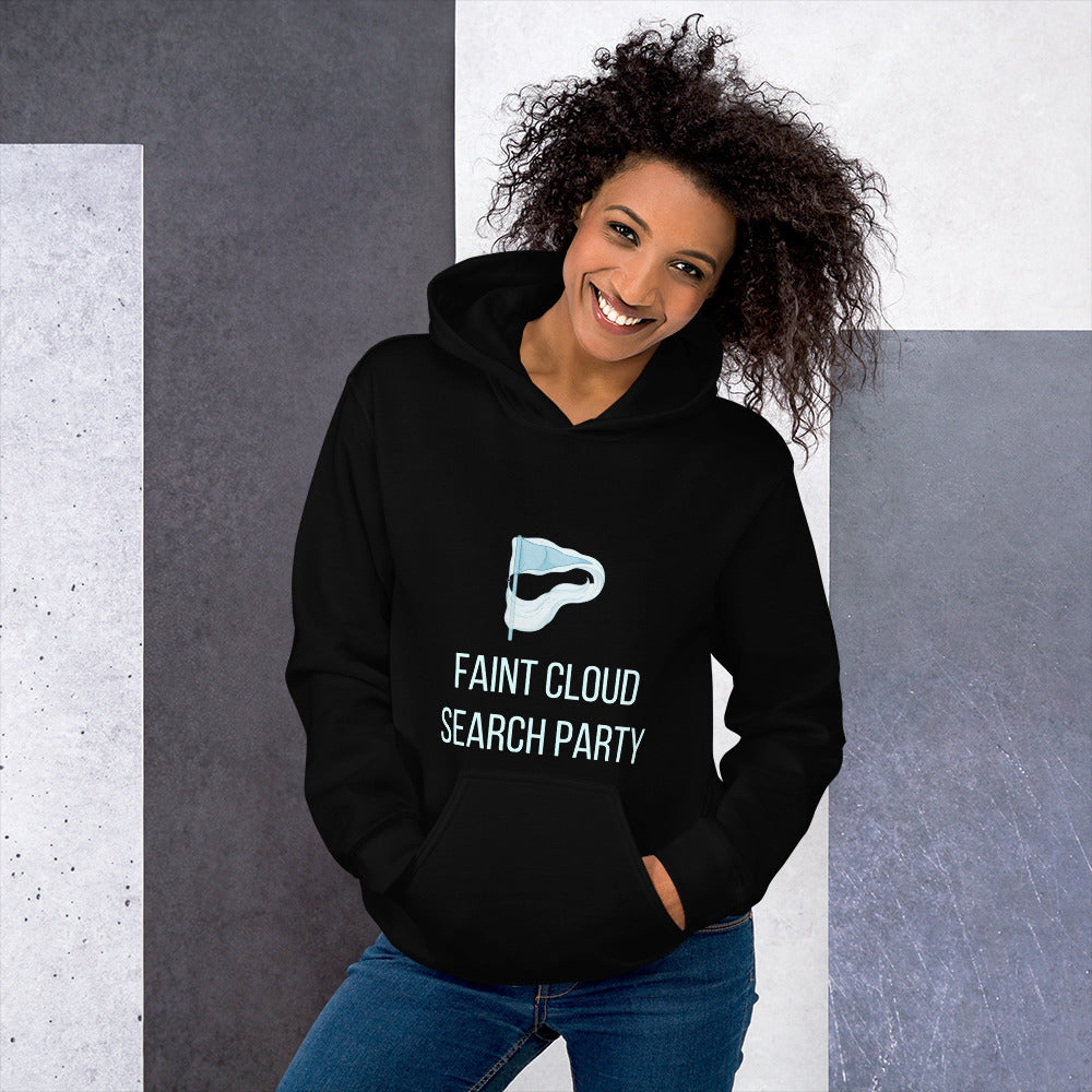 Woman in the black Faint Cloud Search Party astronomy hoodie against a grey stone wall