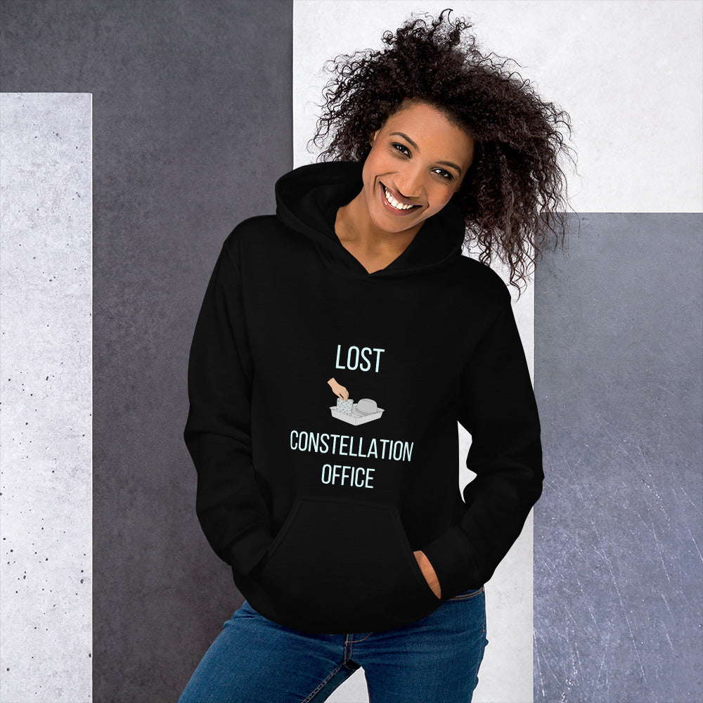 Woman in the black Lost Constellation Office constellation hoodie, hands in the front pocket