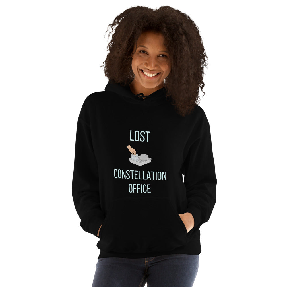 Smiling woman wearing the black Lost Constellation Office constellation hoodie, front view