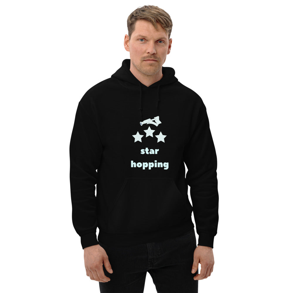 Man wearing the black Star Hopping hoodie with the telescope and three stars print, front view