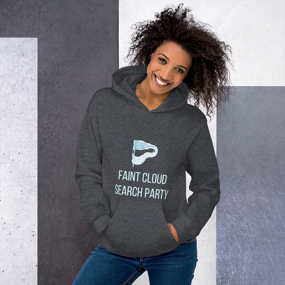 Woman in the dark heather Faint Cloud Search Party astronomy hoodie against a grey stone wall