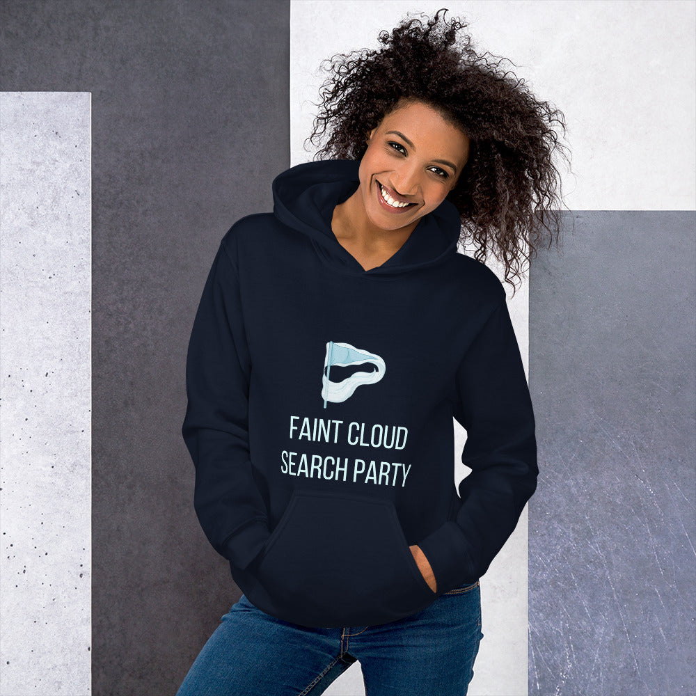 Smiling woman in the navy Faint Cloud Search Party hoodie against a grey stone wall