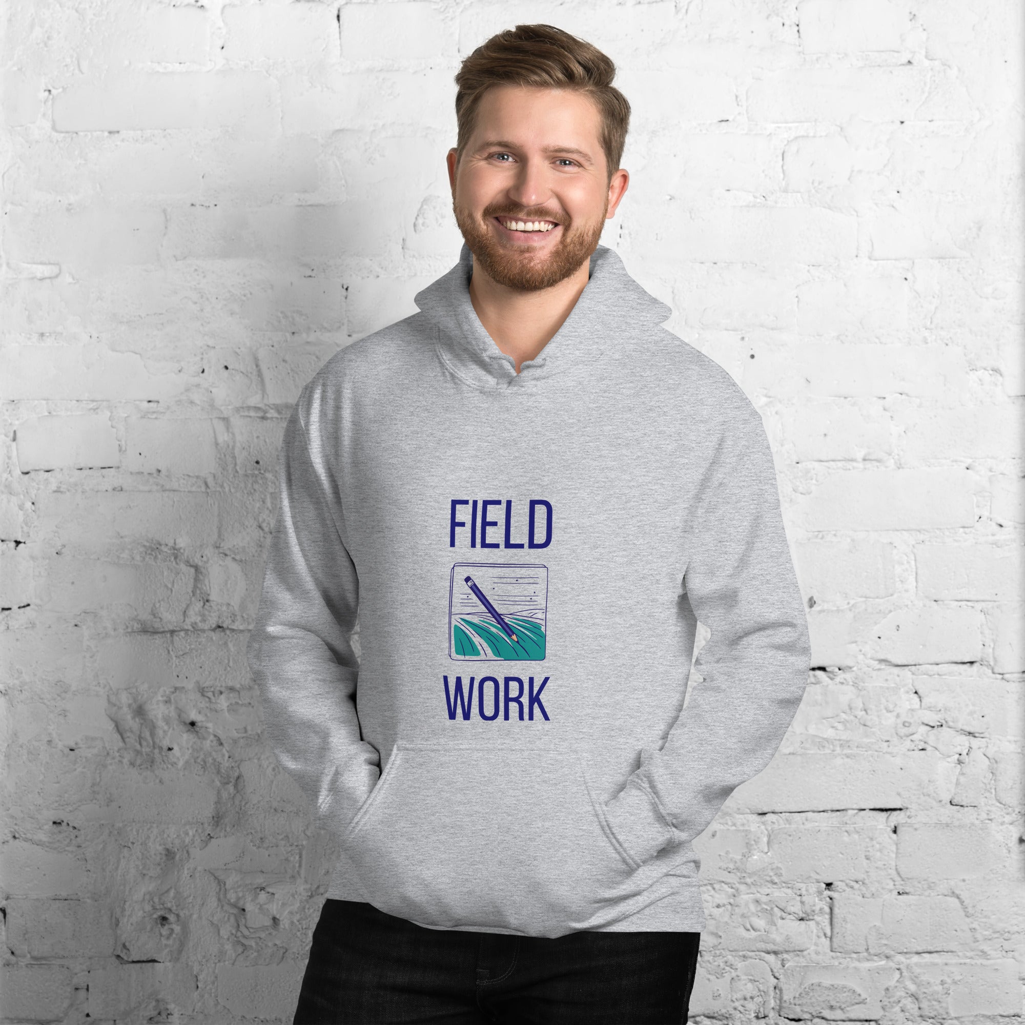 Man in the sport grey Field Work astronomy hoodie by a white brick wall, front view of the notebook print