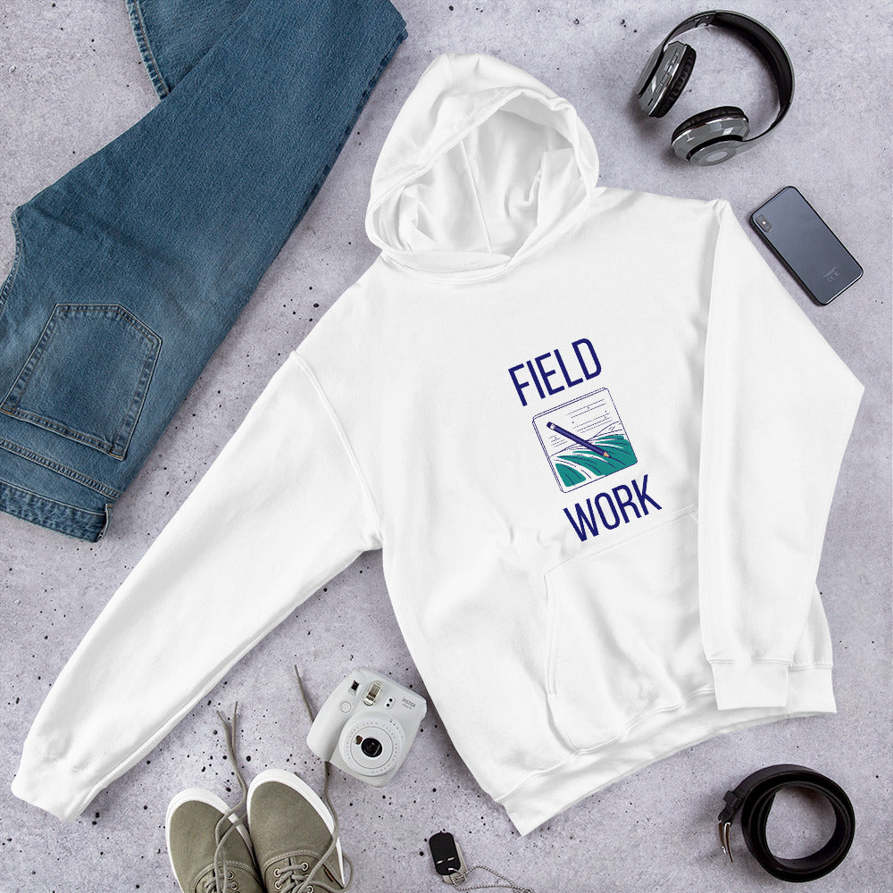 White Field Work astronomy hoodie laid flat with jeans, headphones and an instant camera