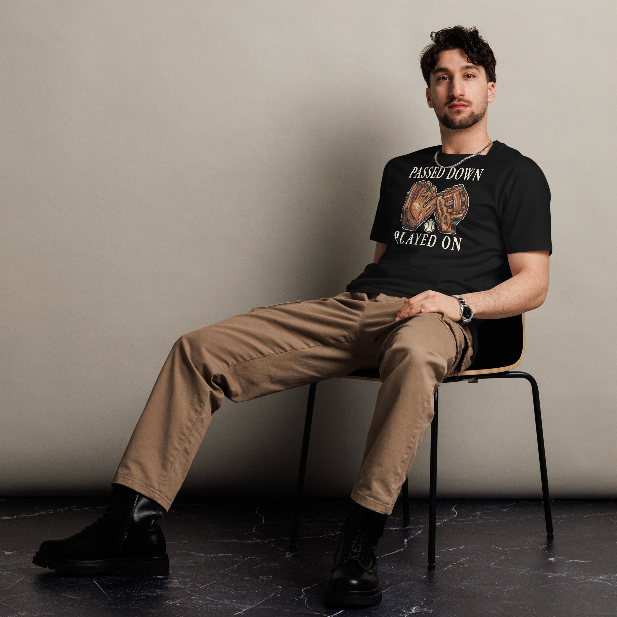 Front view of a man wearing the Baseball Dad Shirt – Passed Down, Played On cotton T-shirt in black.