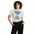 Front view of a woman wearing the Baseball Mom Shirt – Every Inning Counts cotton T-shirt in bone.