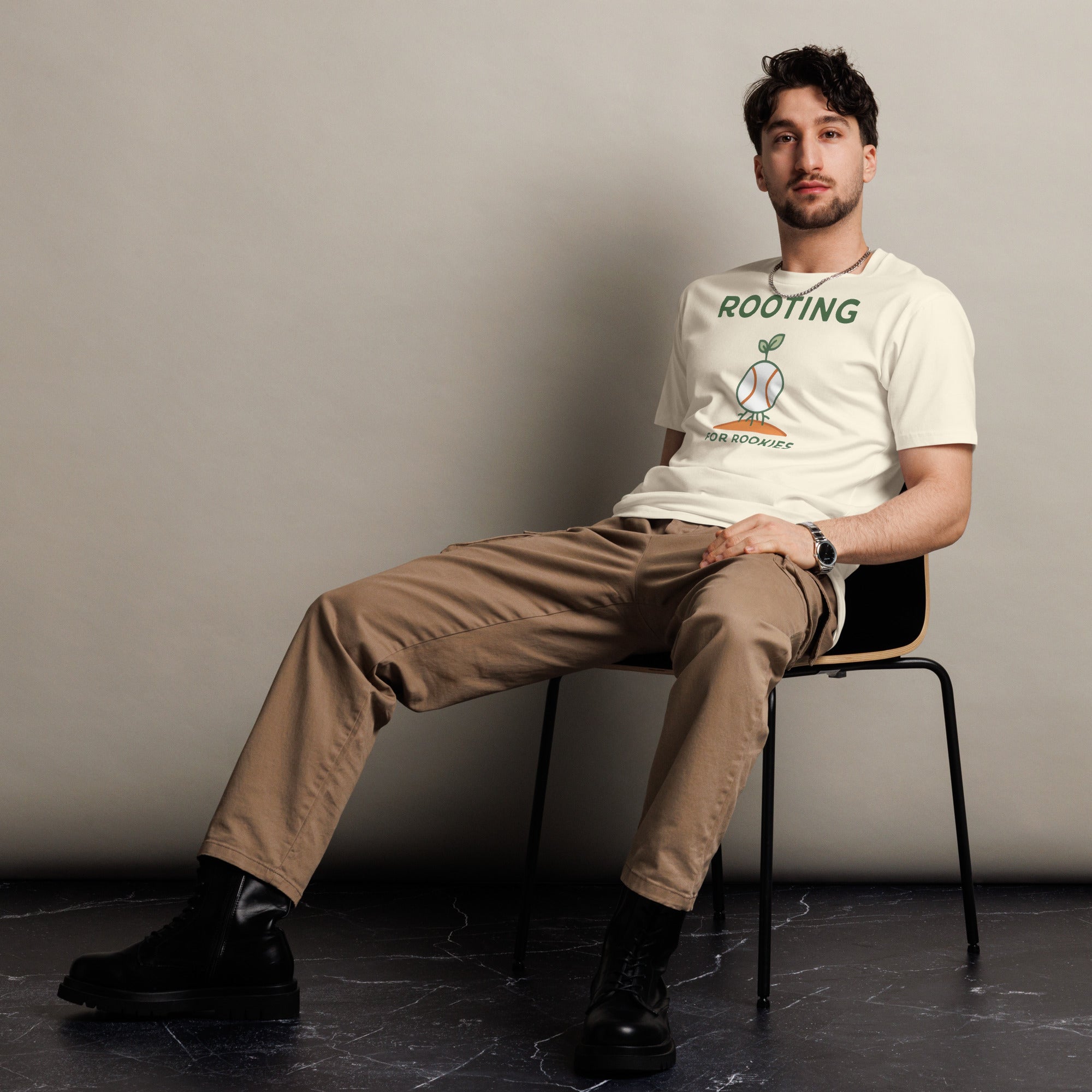 Front view of a man wearing the Baseball Coach Shirt – Rooting for Rookies cotton T-shirt in natural.