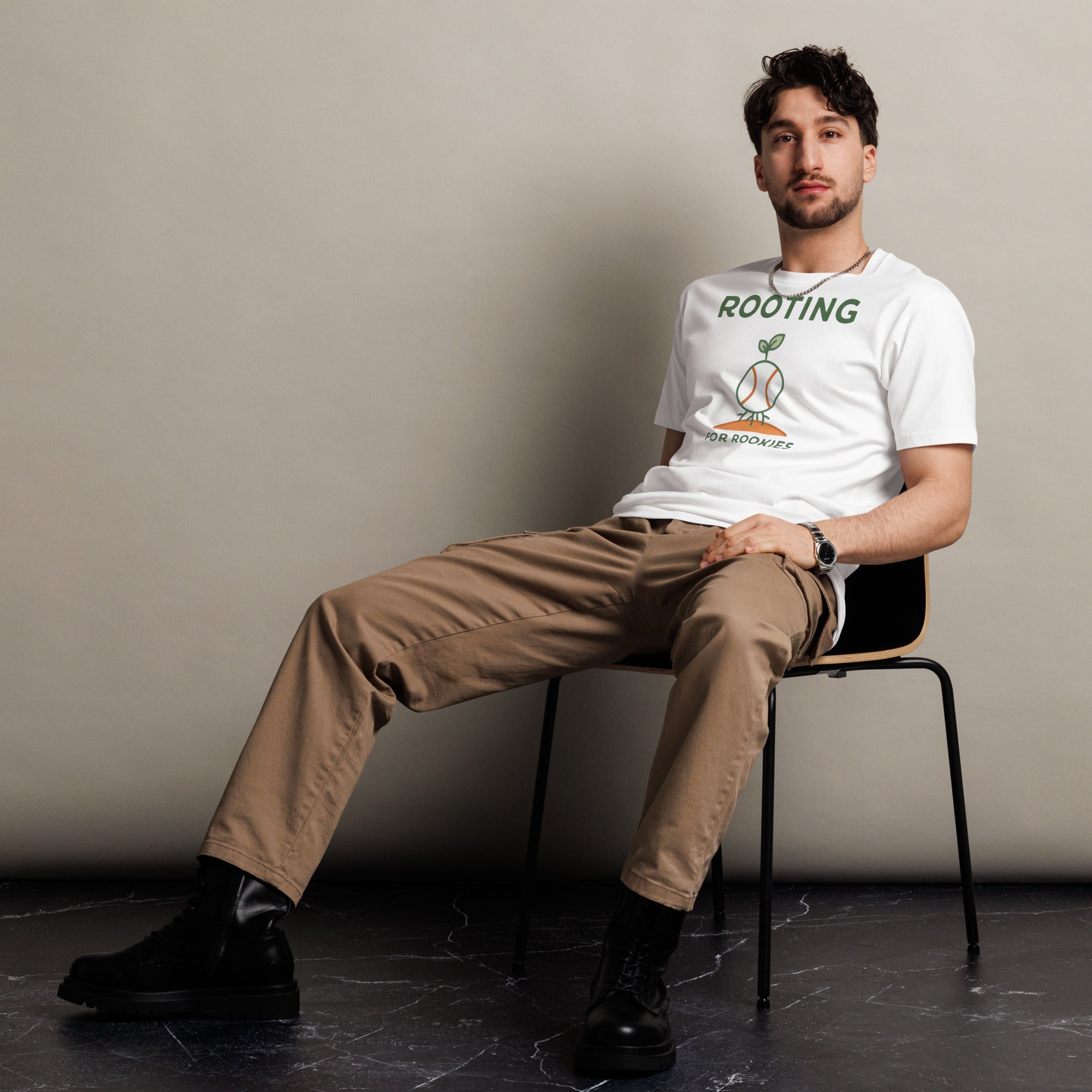 Front view of a man wearing the Baseball Coach Shirt – Rooting for Rookies cotton T-shirt in white.