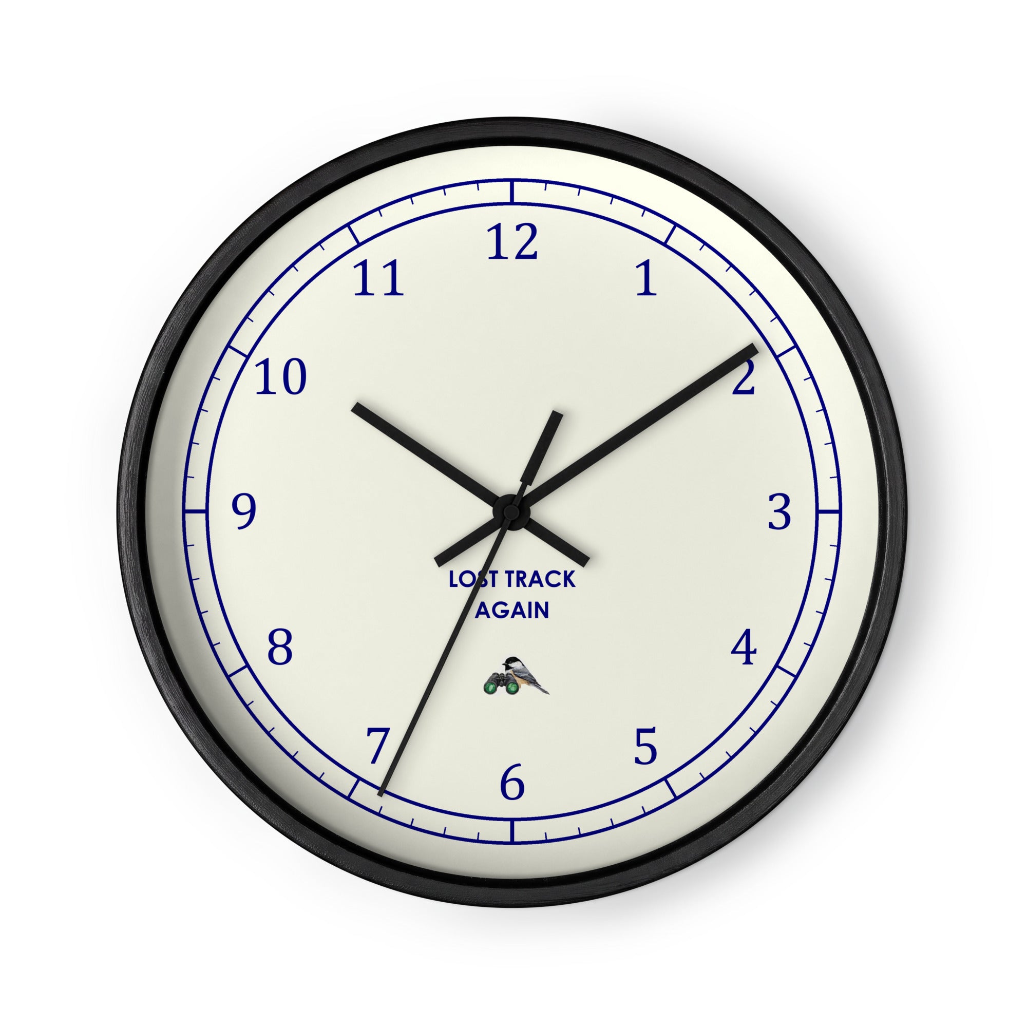 Bird clock with a black frame: LOST TRACK AGAIN in navy under the centre, a small chickadee perched on green binoculars above the six