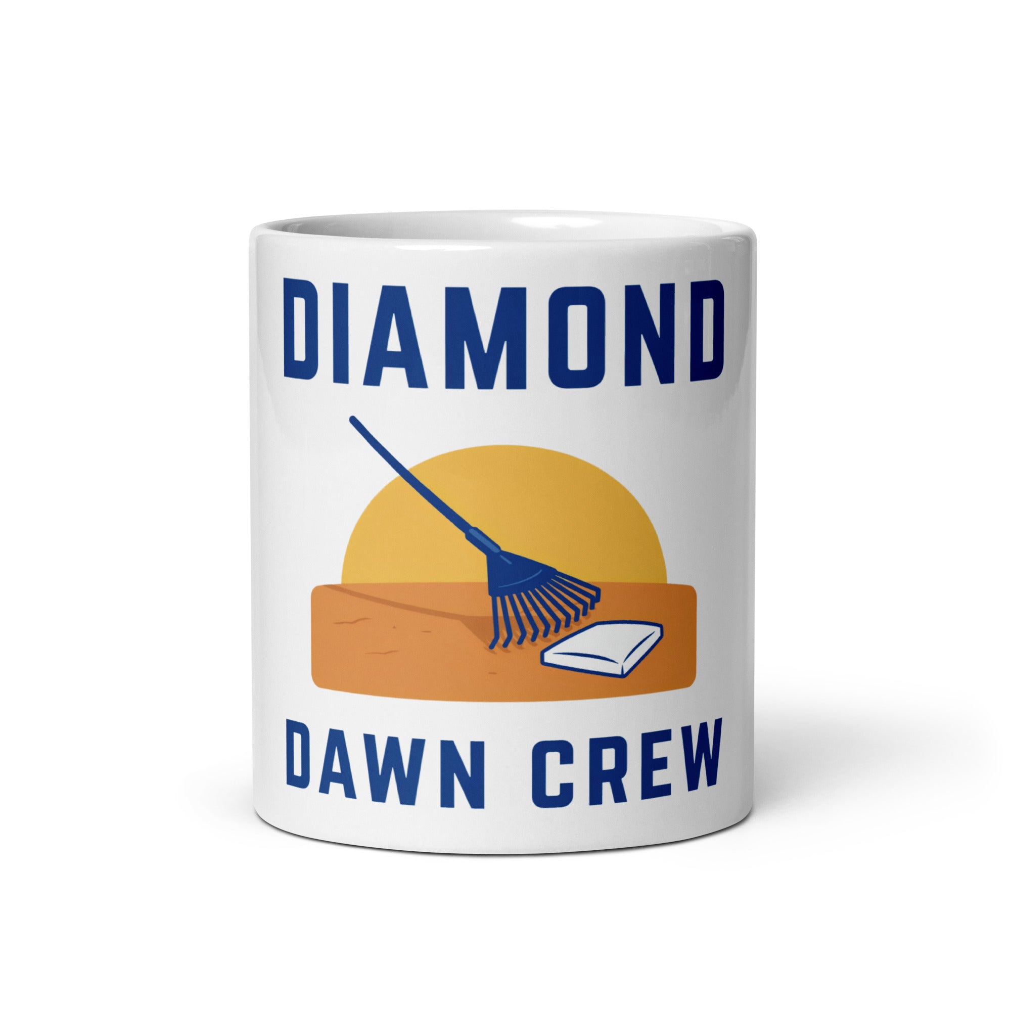 White 11 oz baseball mug with Diamond Dawn Crew lettering, a yellow sunrise, navy rake, orange soil and white home plate; front view.