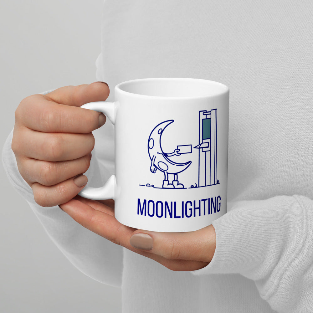Hands in a light sweater holding the 11 oz moonlighting mug, crescent moon and time clock design facing out