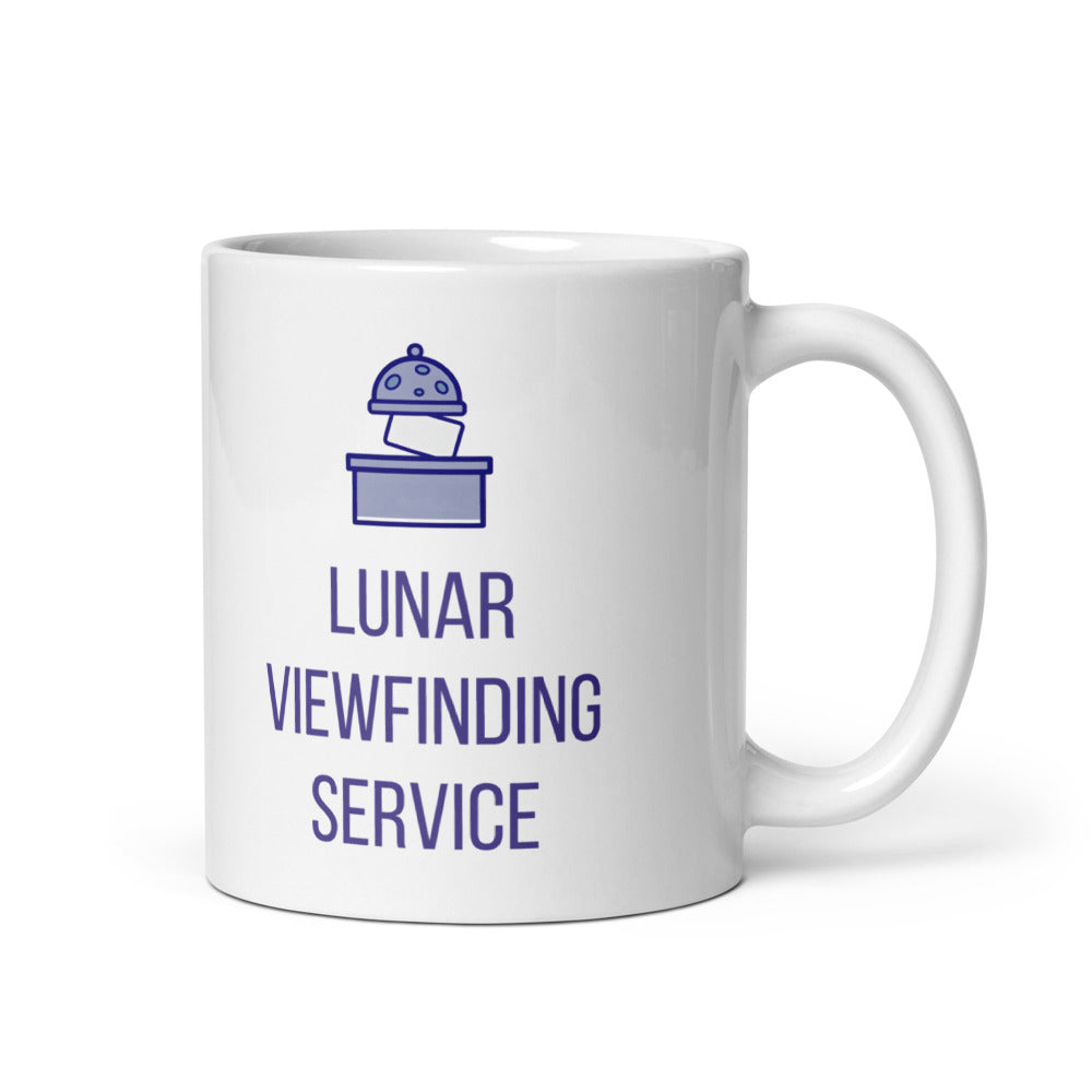 11 oz lunar observer mug, handle on the right, with a crater-spotted dome releasing a reference card above LUNAR VIEWFINDING SERVICE in indigo capitals