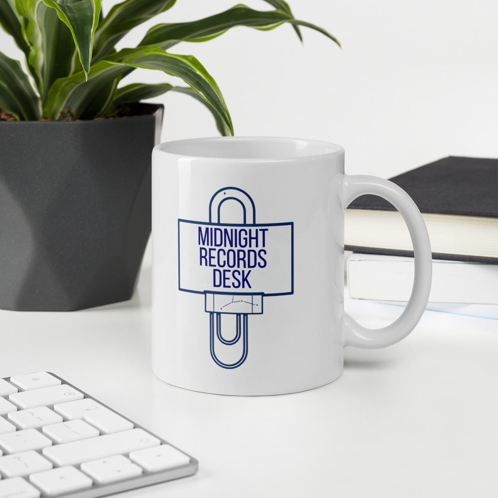 Midnight Records Desk astronomy mug on a desk beside a plant, notebook and keyboard