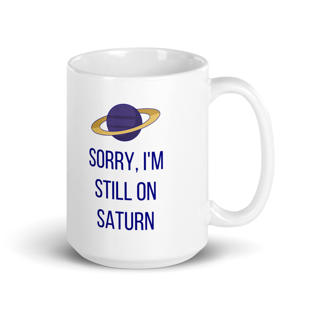 15 oz Saturn mug, handle on the right, the taller size with the gold-ringed planet and Sorry, I'm Still on Saturn lettering