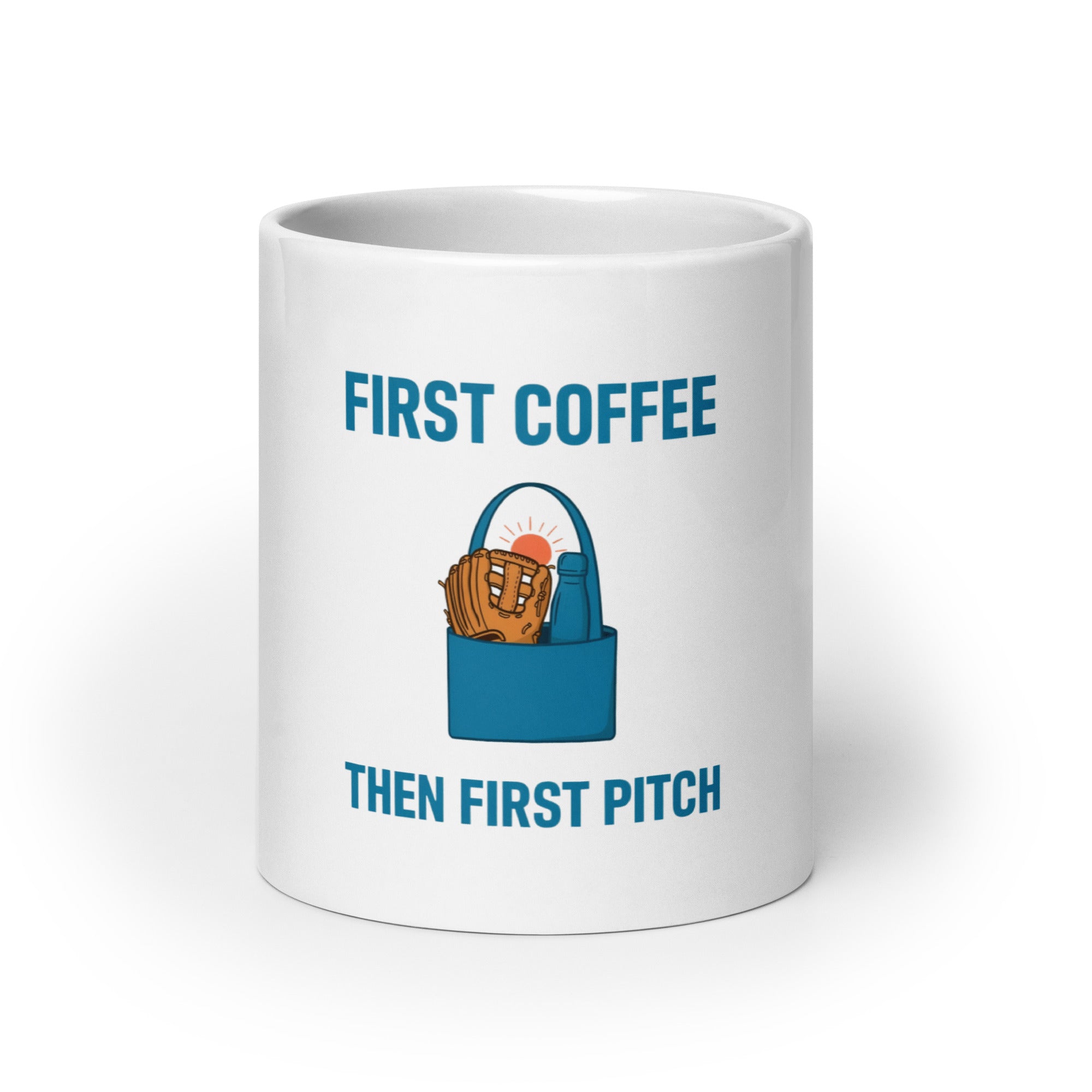 White 20 oz baseball mom mug, front view, with First Coffee, Then First Pitch lettering, a teal tote, glove, flask and sunrise.